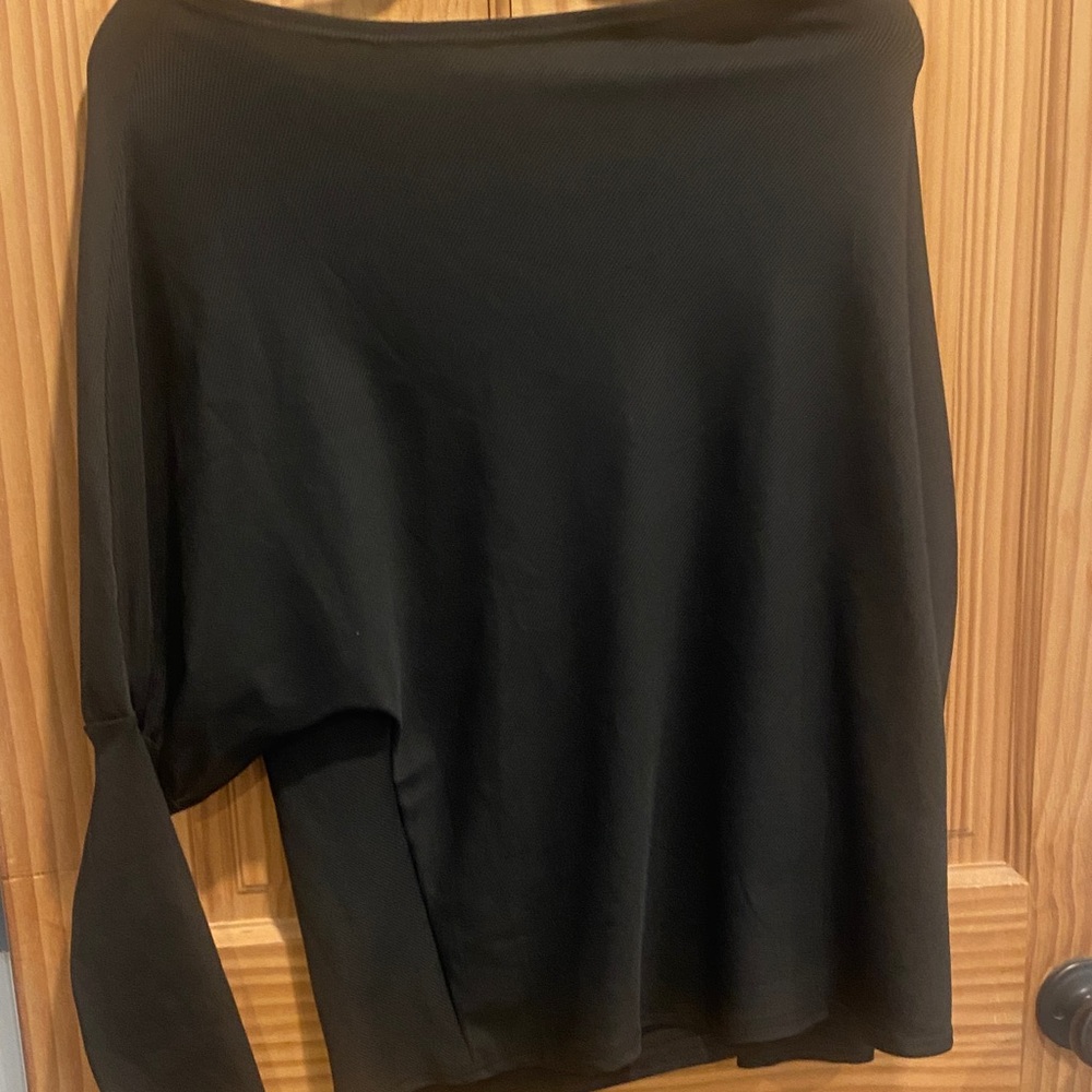 Batwing top with boat neck . Dress up or down ! Highly flattering neckline